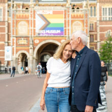 Destination photographer Amsterdam — couple at the Rijksmuseum archway, visiting Amsterdam