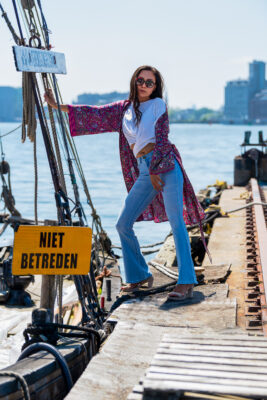 Fashion photographer Amsterdam — woman in flowing outfit on the industrial pier at NDSM, Amsterdam Noord