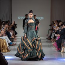 Fashion model walks runway wearing the latest line of clothes of world-known designers Shantanu & Nikhil.