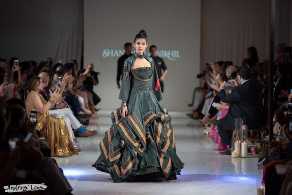 Fashion model walks runway wearing the latest line of clothes of world-known designers Shantanu & Nikhil.
