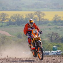 Motorbike racing through the fields at the European Dakar Rally