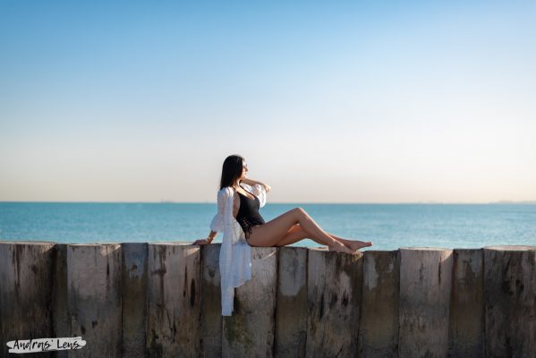 Portrait of a woman sunbathing at a beach in Dubai enjoying the breathtaking view.